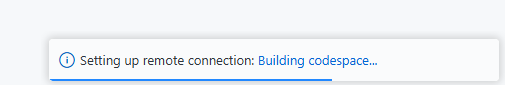 Screenshot showing the building codespace notification in VS Code.